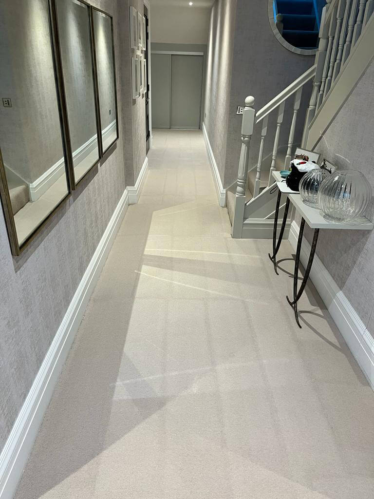 Hallway Carpet Cleaning Surrey Long cream hallway carpet after a professional clean in a Surrey home, with fresh grooming lines