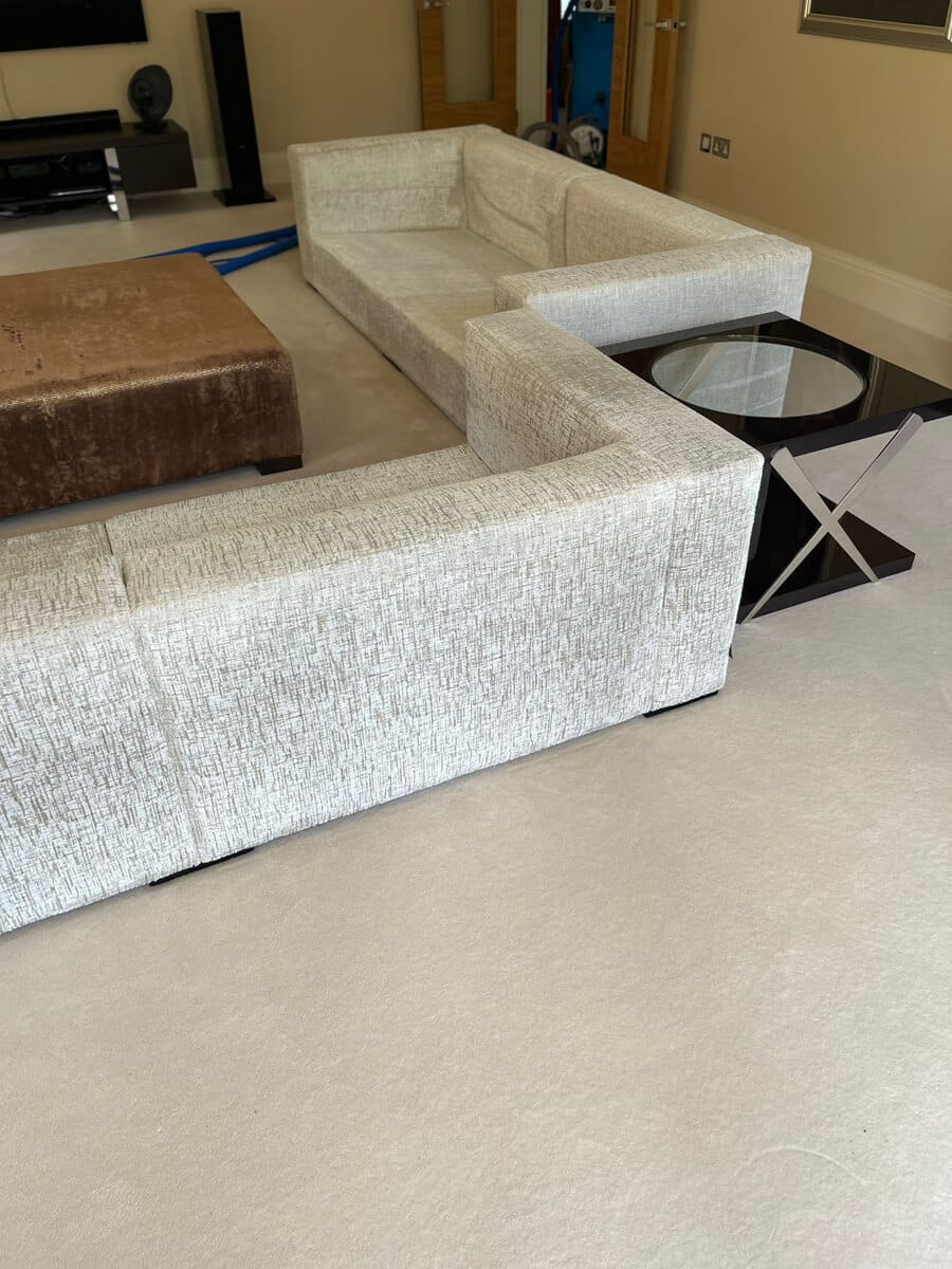 Cream Corner Sofa Cleaning Surrey Large cream fabric corner sofa in a living room after cleaning