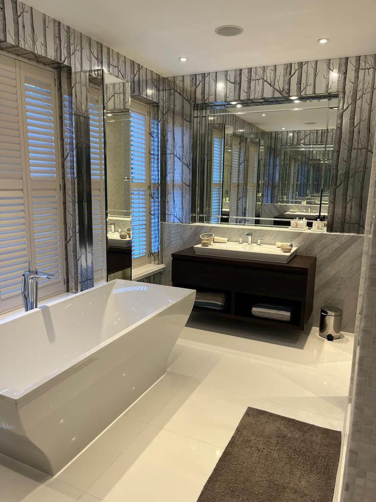 Domestic Cleaning Bathroom Surrey Bright bathroom with a freestanding bath and vanity unit after a domestic clean