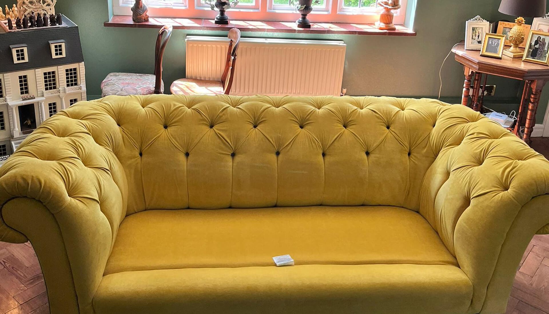 Velvet Chesterfield Sofa Cleaning Surrey Mustard yellow velvet Chesterfield sofa in a period living room